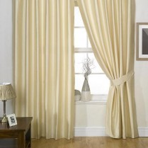 Pair of Cream  Faux Silk Eyelet Curtains